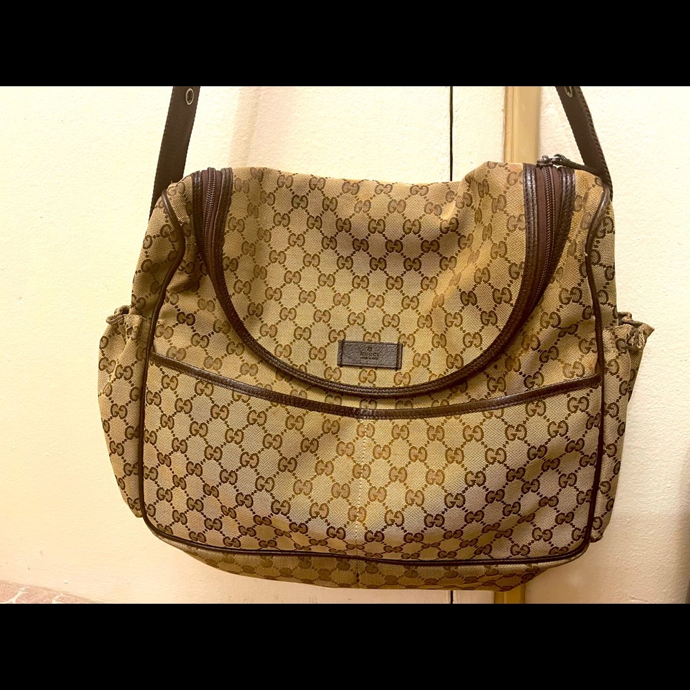 Brown Gucci diaper bag